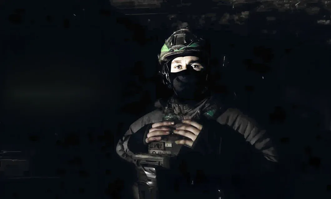 A Ukrainian soldier pauses in a quiet moment amid the ongoing war.